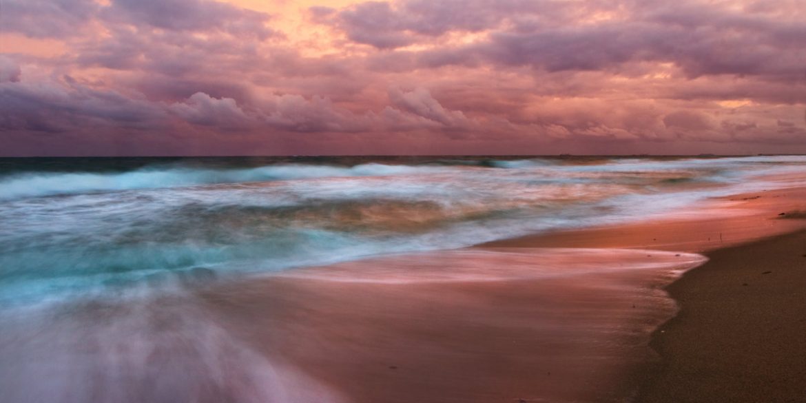 A long exposure photo taken at sunset on the beach in South Florida