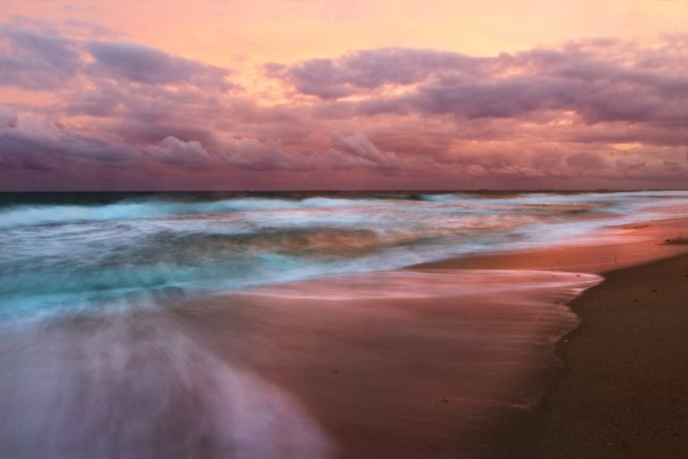 A long exposure photo taken at sunset on the beach in South Florida