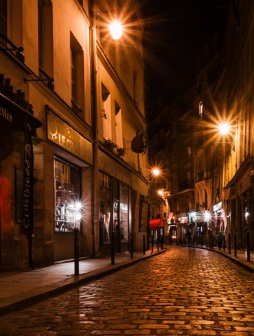 Cobblestone Paris street at night