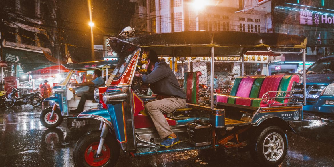 A tuk tuk waiting in the rain in Bangkok, Thailand's Chinatown