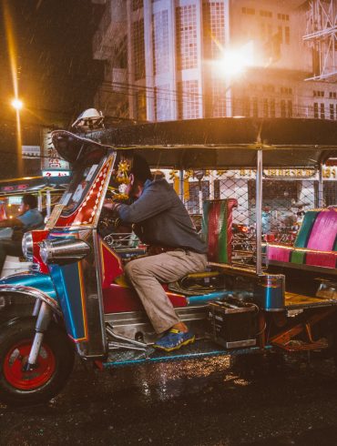 A tuk tuk waiting in the rain in Bangkok, Thailand's Chinatown